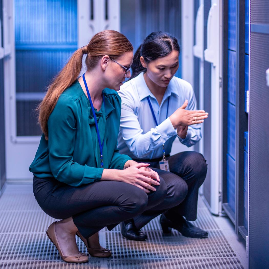 female data center technicians evaluating rf site survey backend